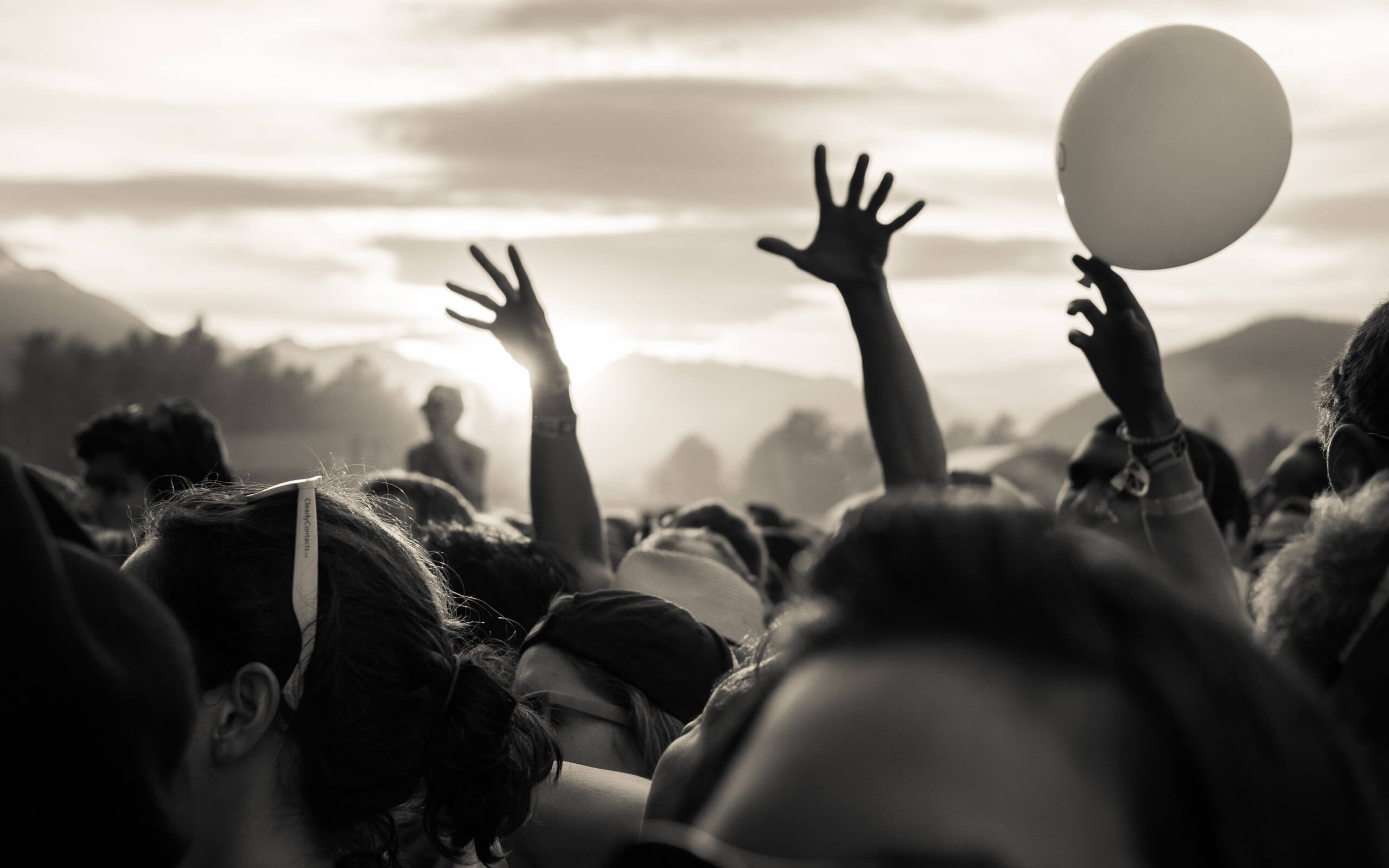 Music Images. Concert photography image of two hands raised seeking energy at a music festival.