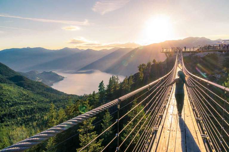 Stock Images Photos. Stock Photography of a woman on the Sea to Sky Suspension Bridge in Squamish