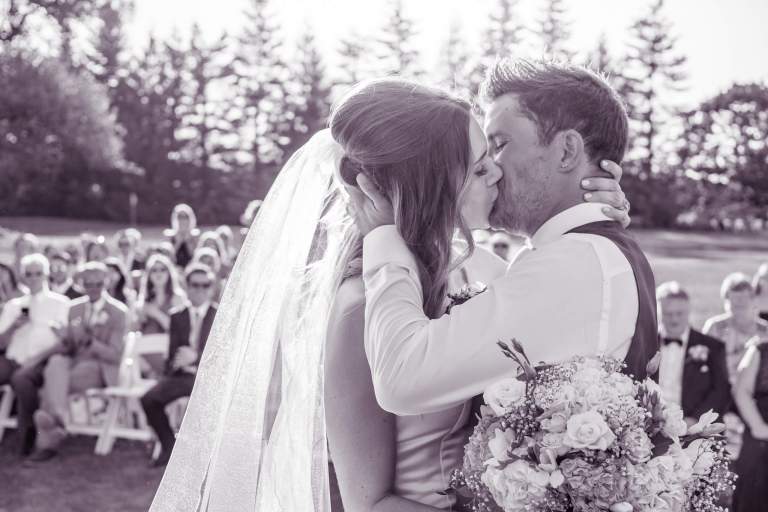 Wedding Photos. LIFELIGHTLENS image of a couple's first kiss